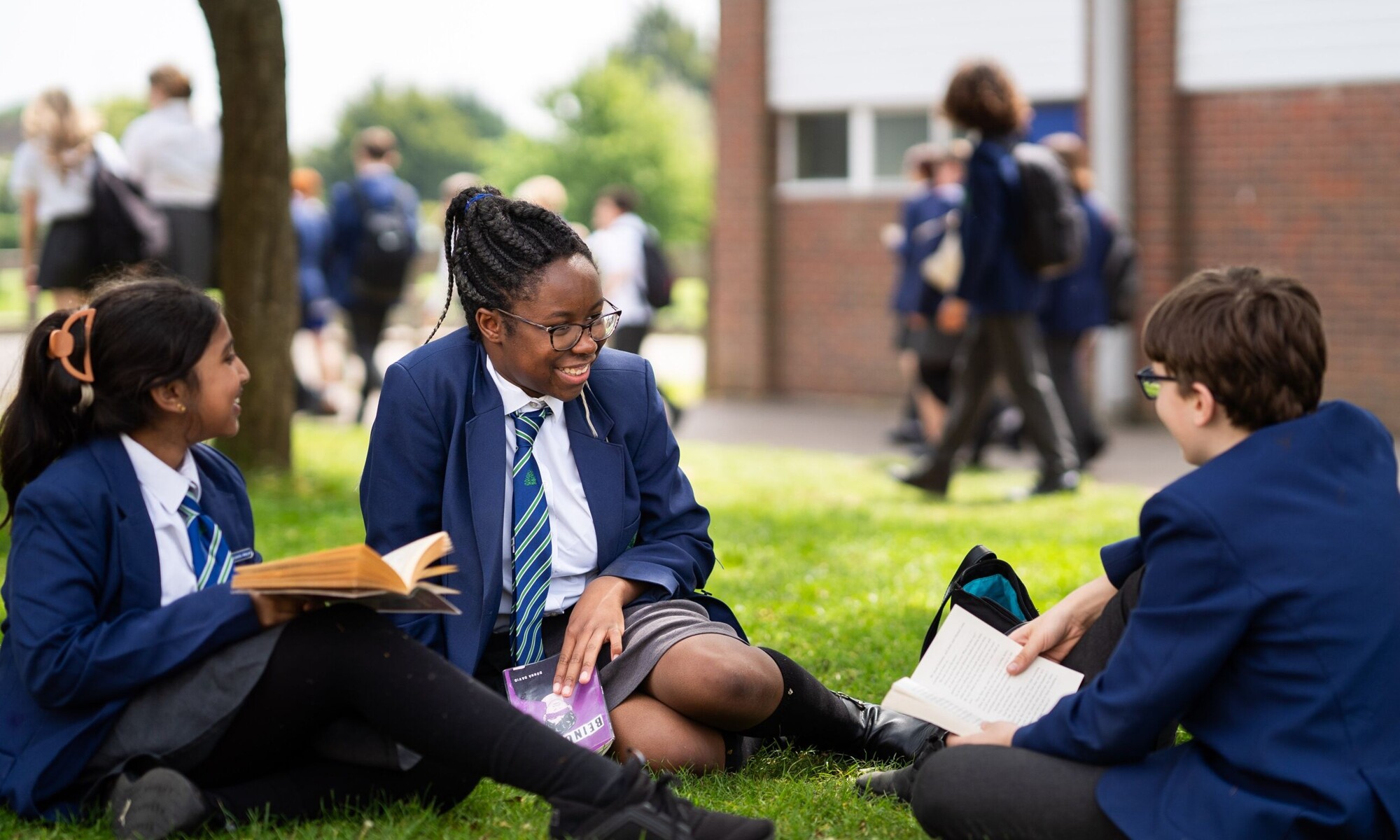 TKAT Trust Students Reading Outside